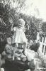 Lois Van Pelt on fish pond in front yard, 4 Dec 1941, Glendale, CA